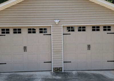 beige single two door garage grooved panel