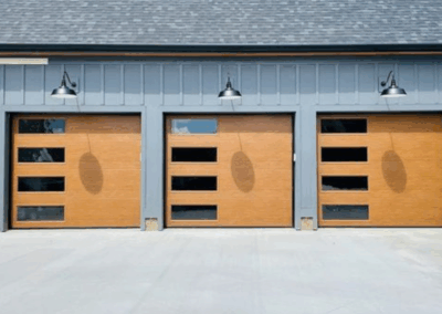 three single car wood overlay flush panel garage