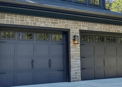 two single car long grooved garage panels