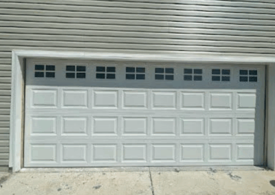 white traditional raised panel two car garage