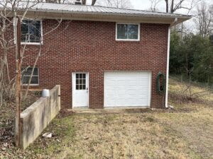 interior view of newly installed white recessed panel garage door with updated track system in harrisburg